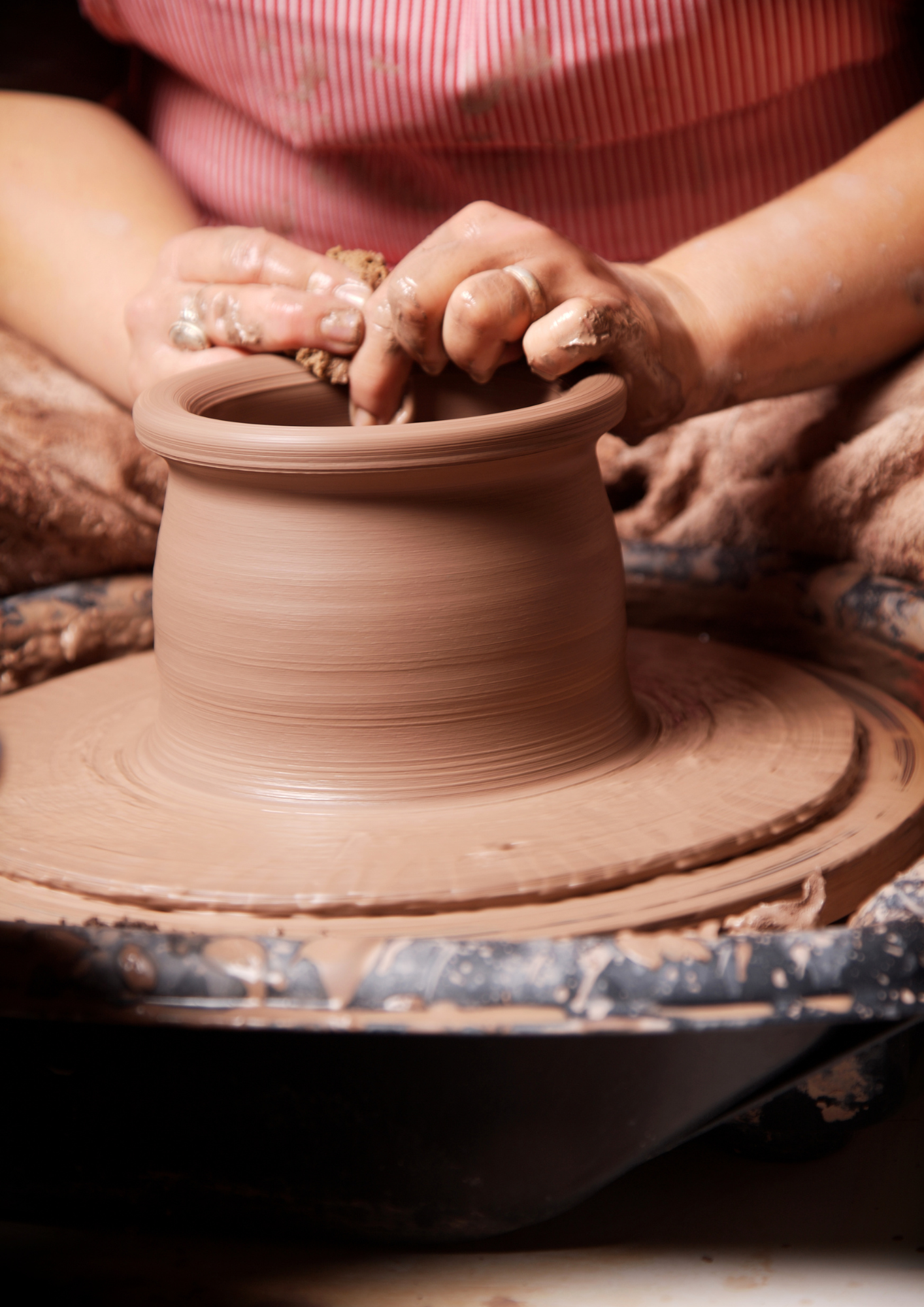 Wet clay spinning on a potter's wheel